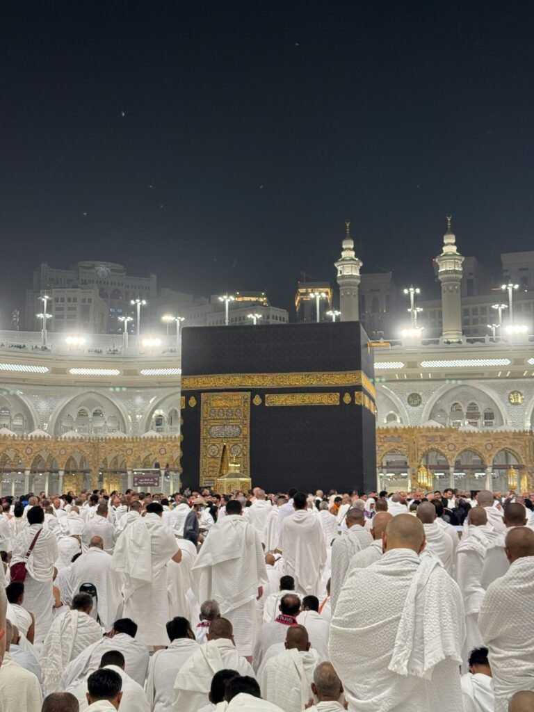 Pilgrims gather for prayer around the Kaaba in Mecca, Saudi Arabia during Hajj at night.